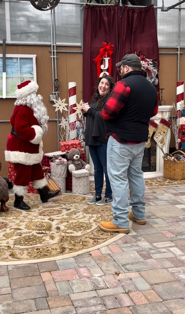 Santa helps couple get engaged.